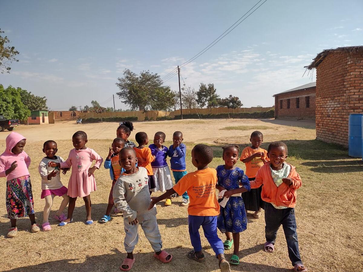 A group of children playing together in the schoolyard